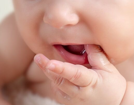 Child chewing on thumb