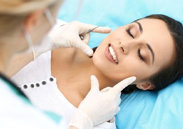 Woman having smile examined by dentist