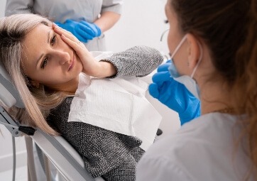 Woman discussing financial options available for emergency dentistry