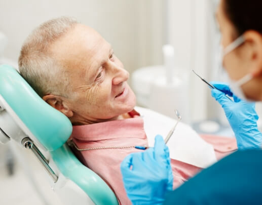 Dental patient receiving oral cancer screening