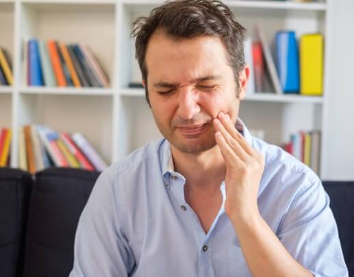 Man in pain before gum disease treatment